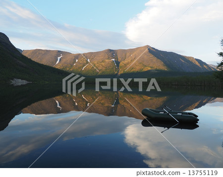 boat on a lake in the mountains 13755119