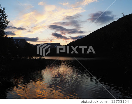 sunset on the mountain lake 13755194