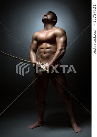 Screaming naked man bounded with rope 13757521
