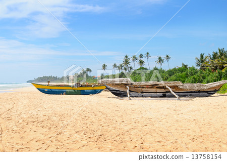 old fishing boat on the sandy shore 13758154