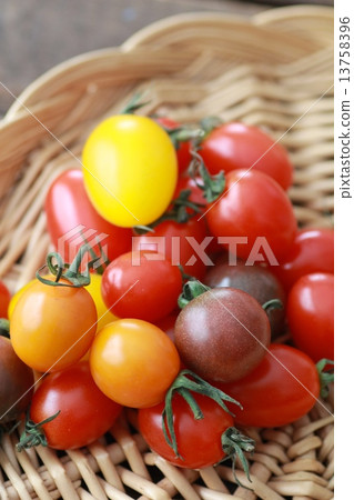 Various kinds of colorful cherry tomatoes on a basket Various kinds of colorful cherry tomatoes on a basket 13758396