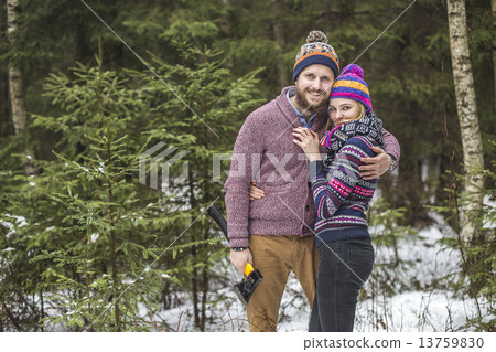 Young pair searching a christmas tree 13759830