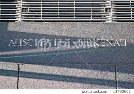 auschwitz - birkenau, message closeup on stone wall auschwitz - birkenau, message closeup on stone wall 13760662