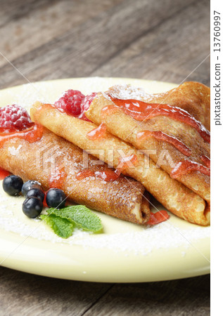 Crepe with raspberries and blueberries 13760997