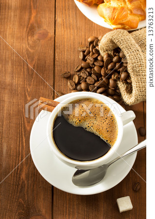 cup of coffee on wood 13763213