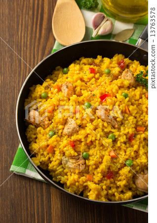 frying pan full of rice on wood frying pan full of rice on wood 13763578