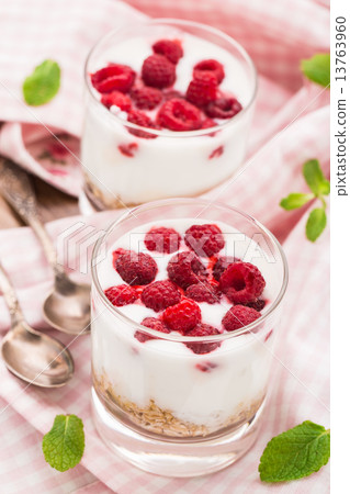 Yogurt with muesli and raspberries Yogurt with muesli and raspberries 13763960