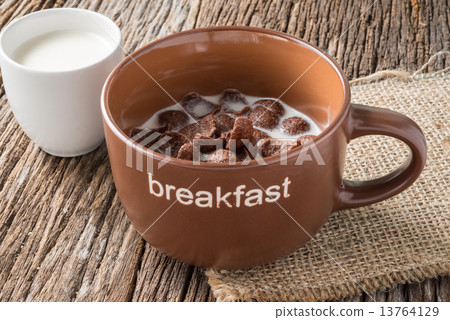 Chocolate cornflakes on wooden background Chocolate cornflakes on wooden background 13764129