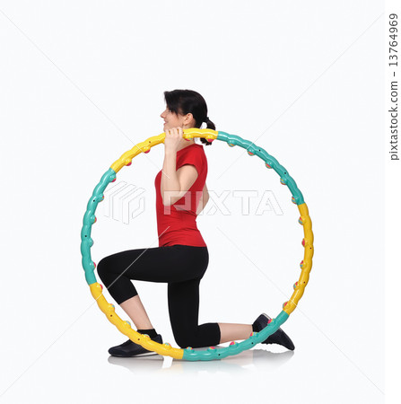 woman sitting with color hula hoop woman sitting with color hula hoop 13764969