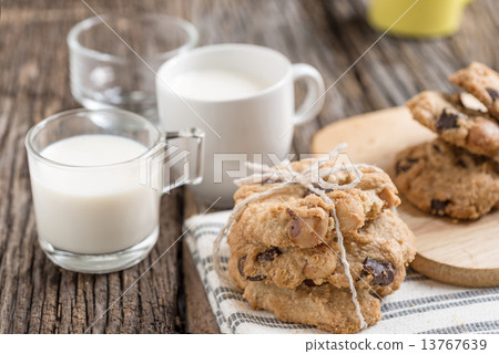 Stack of Chocolate chip cookie and glass of milk Stack of Chocolate chip cookie and glass of milk 13767639