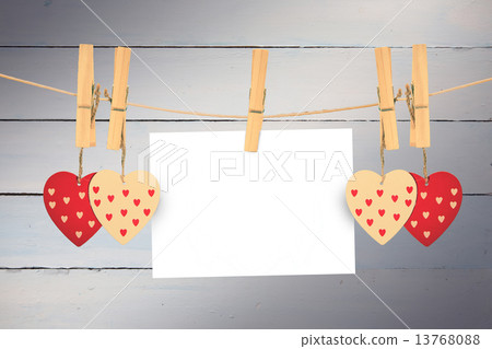 Composite image of hearts hanging on the line Composite image of hearts hanging on the line 13768088