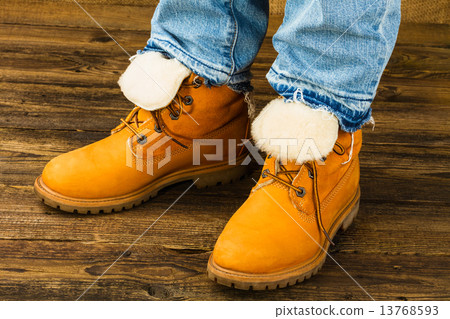 female feet in winter boots and jeans 13768593