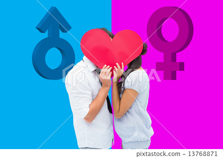 Composite image of couple covering their kiss with a heart 13768871