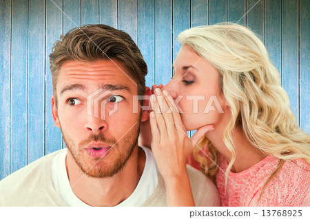 Composite image of attractive blonde whispering secret to boyfri 13768925