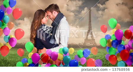 Composite image of side view of young couple embracing Composite image of side view of young couple embracing 13768936