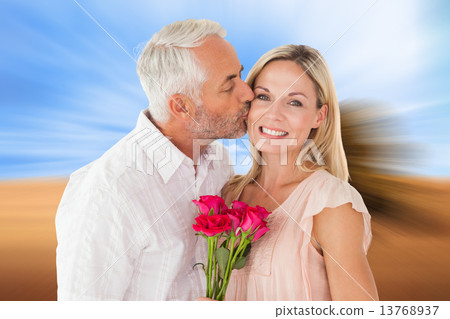 Composite image of affectionate man kissing his wife on the chee Composite image of affectionate man kissing his wife on the chee 13768937