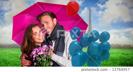 Composite image of cheerful young couple with flowers and umbrel Composite image of cheerful young couple with flowers and umbrel 13768957