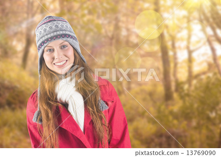 Composite image of pretty redhead in warm clothing 13769090