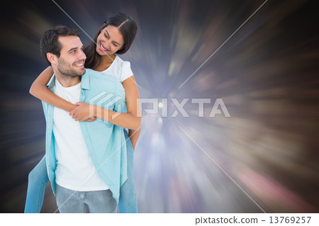 Composite image of happy casual man giving pretty girlfriend pig Composite image of happy casual man giving pretty girlfriend pig 13769257