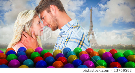 Composite image of attractive couple smiling at each other Composite image of attractive couple smiling at each other 13769592