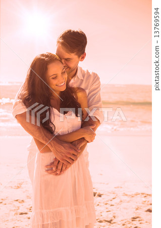 Affectionate couple cuddling Affectionate couple cuddling 13769594