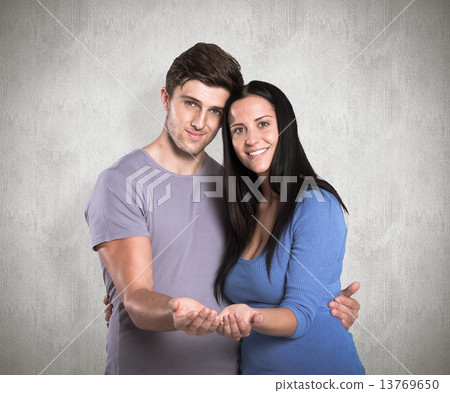 Composite image of young couple holding out hands 13769650
