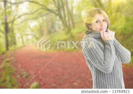 Composite image of pretty girl in jumper 13769921