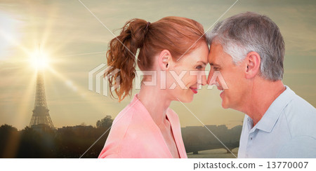 Composite image of casual couple smiling at each other 13770007