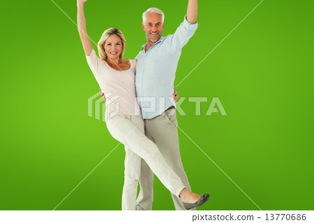 Composite image of smiling couple cheering at the camera Composite image of smiling couple cheering at the camera 13770686