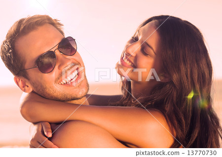 Cheerful loving couple hugging each other Cheerful loving couple hugging each other 13770730
