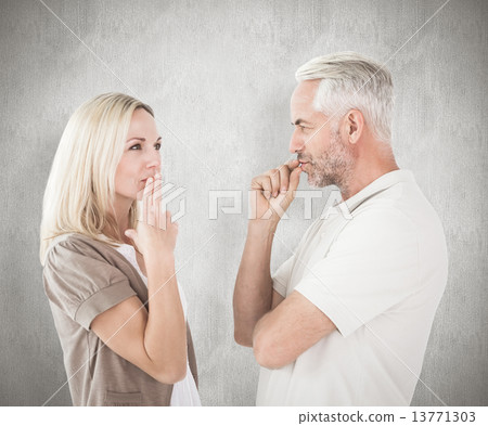 Composite image of couple staying silent with fingers on lips Composite image of couple staying silent with fingers on lips 13771303
