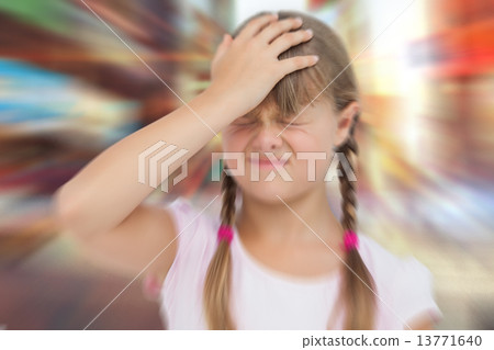 Composite image of little girl with headache 13771640
