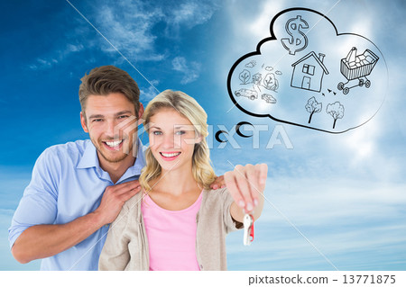 Composite image of attractive young couple showing new house key Composite image of attractive young couple showing new house key 13771875