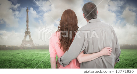 Composite image of casual couple standing arm around Composite image of casual couple standing arm around 13771920
