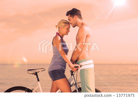 Cute couple together with their bicycles 13771975