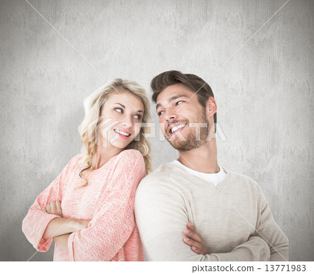 Composite image of attractive couple smiling with arms crossed Composite image of attractive couple smiling with arms crossed 13771983