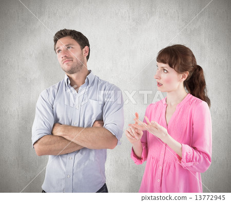 Composite image of woman arguing with uncaring man 13772945