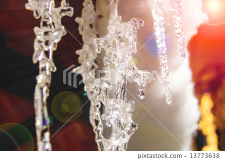 Icicle in light of the of evening sun Icicle in light of the of evening sun 13773638