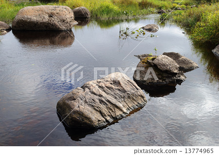 Large rocks in a small river 13774965