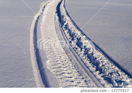 Snowmobile track in snow 13775917