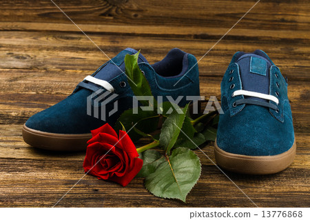 dark blue man's shoes and rose 13776868