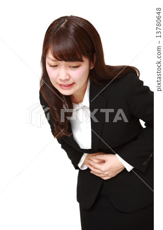 Business woman suffering from abdominal pain Business woman suffering from abdominal pain 13780648