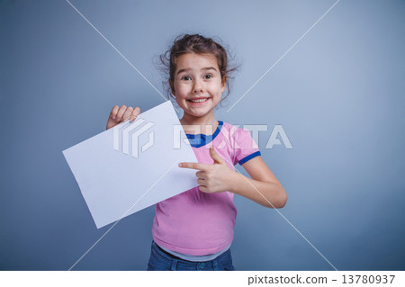 girl child 6 years of European appearance holds a clean sheet, s girl child 6 years of European appearance holds a clean sheet, s 13780937