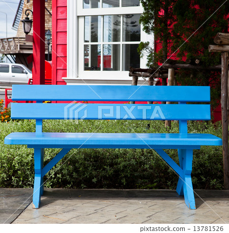 Blue wooden lawn chairs in the spring garden. 13781526