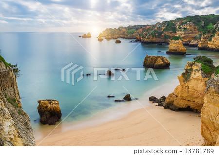 Sea beach at sunset. Cloudy sky. Portugal, Algarve, Lagos. 13781789
