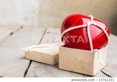 Hearts tied with a rope in the box 13782181