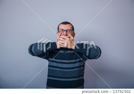European-looking man of 30 years with glasses, closed his mouth  13782502