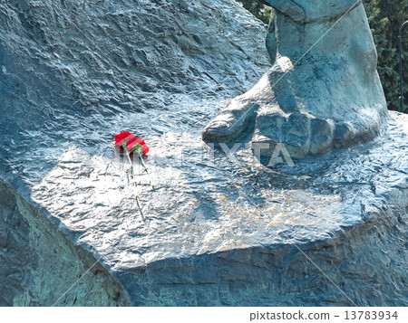 Image of gray monument with two flowers Image of gray monument with two flowers 13783934