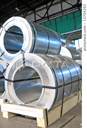 rolls of steel sheet in a warehouse rolls of steel sheet in a warehouse 13784263