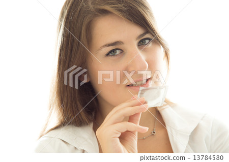 brunette woman holding packed condom against white background 13784580